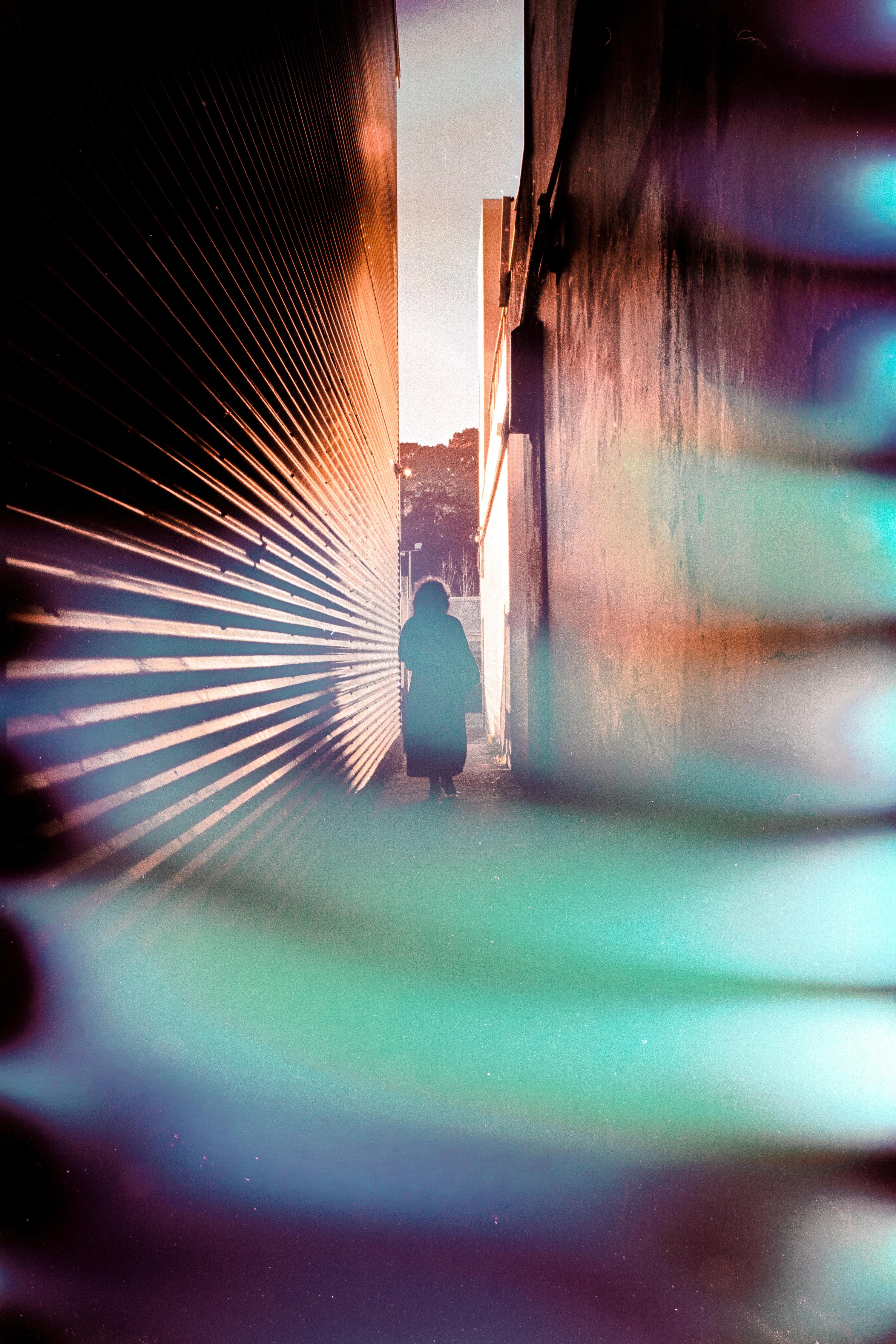 Photo of woman walking down corridor taken on souped film 