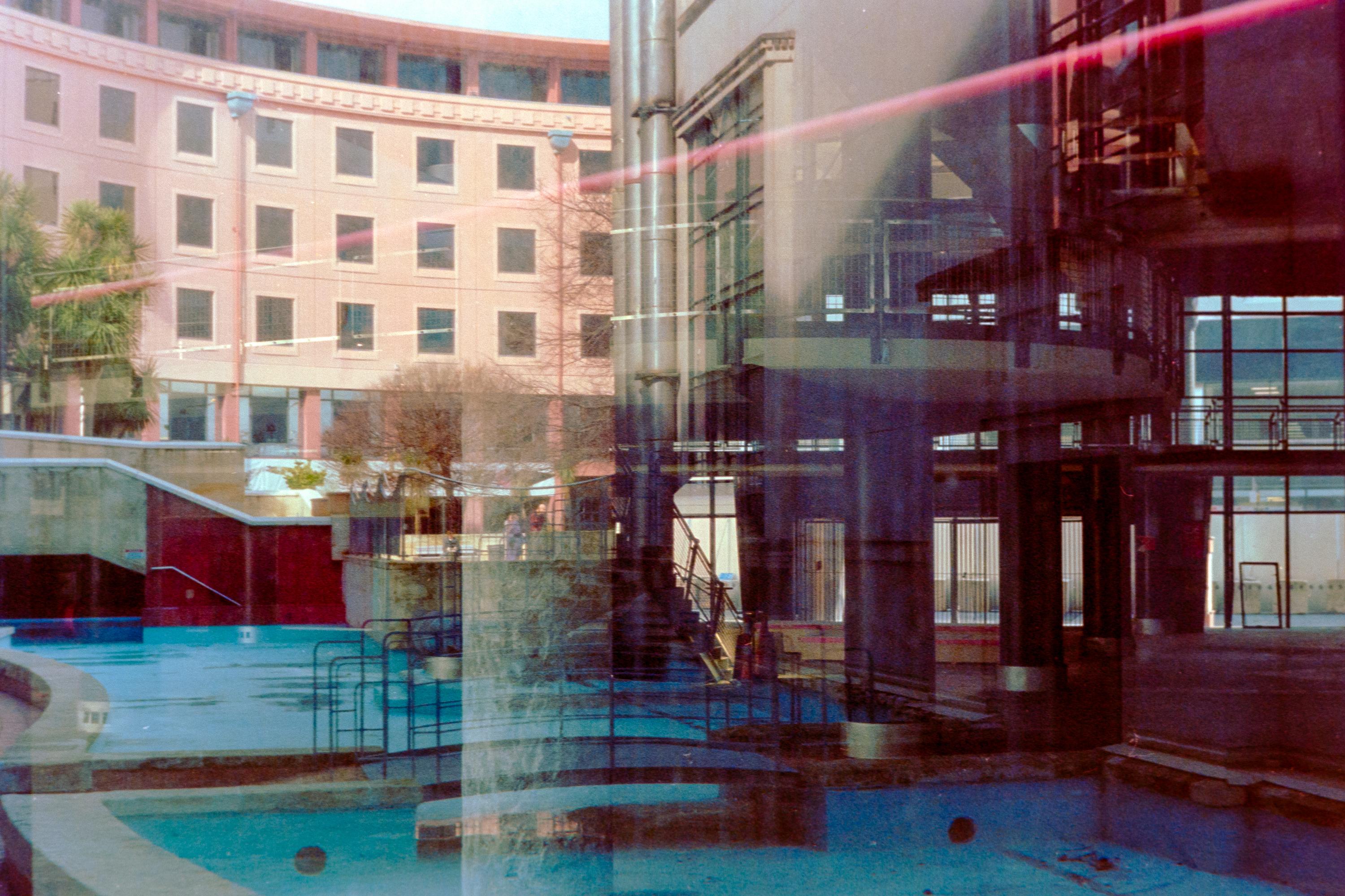 Photo of reflections in a busy city window