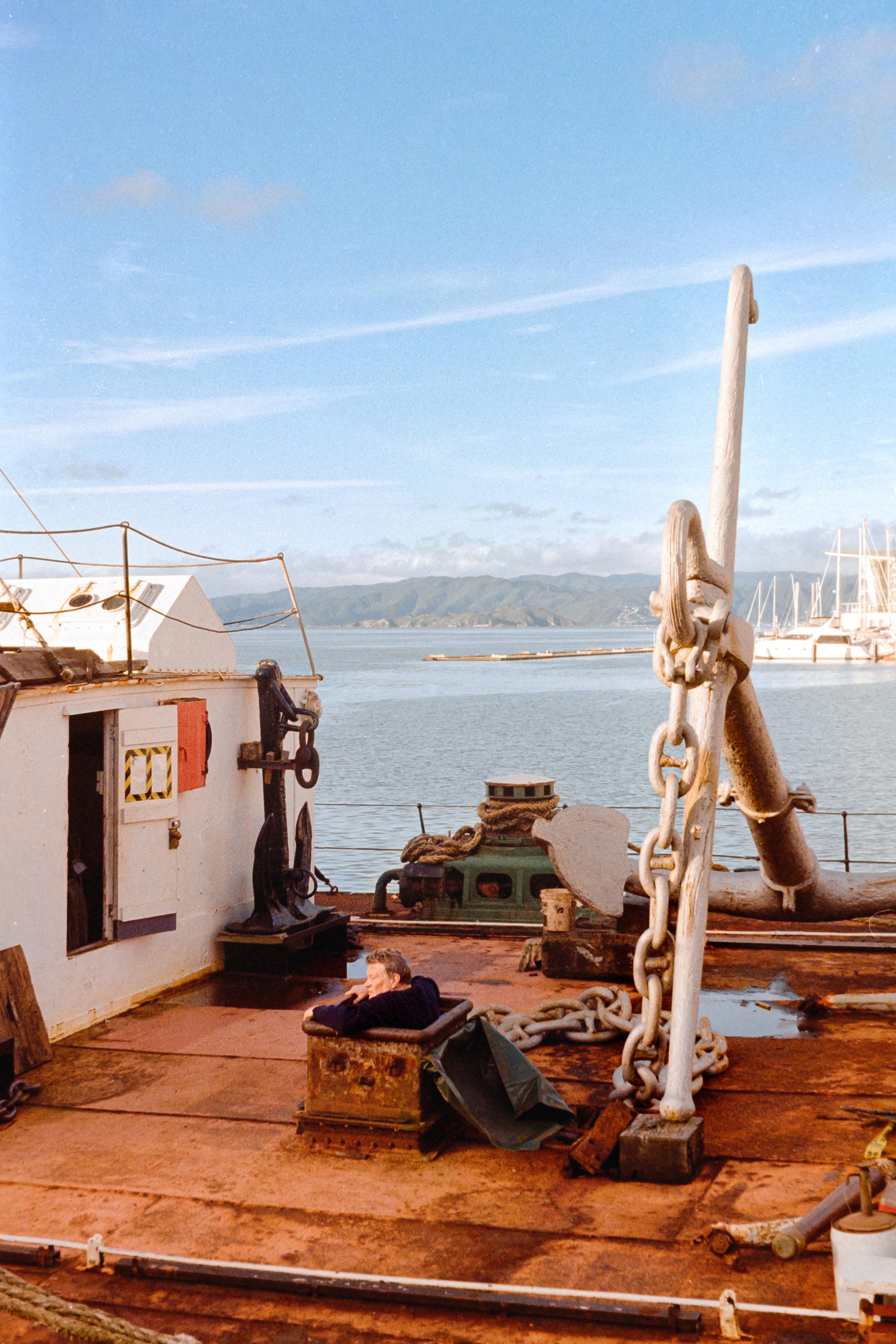 Photo of a man in a box on a ship