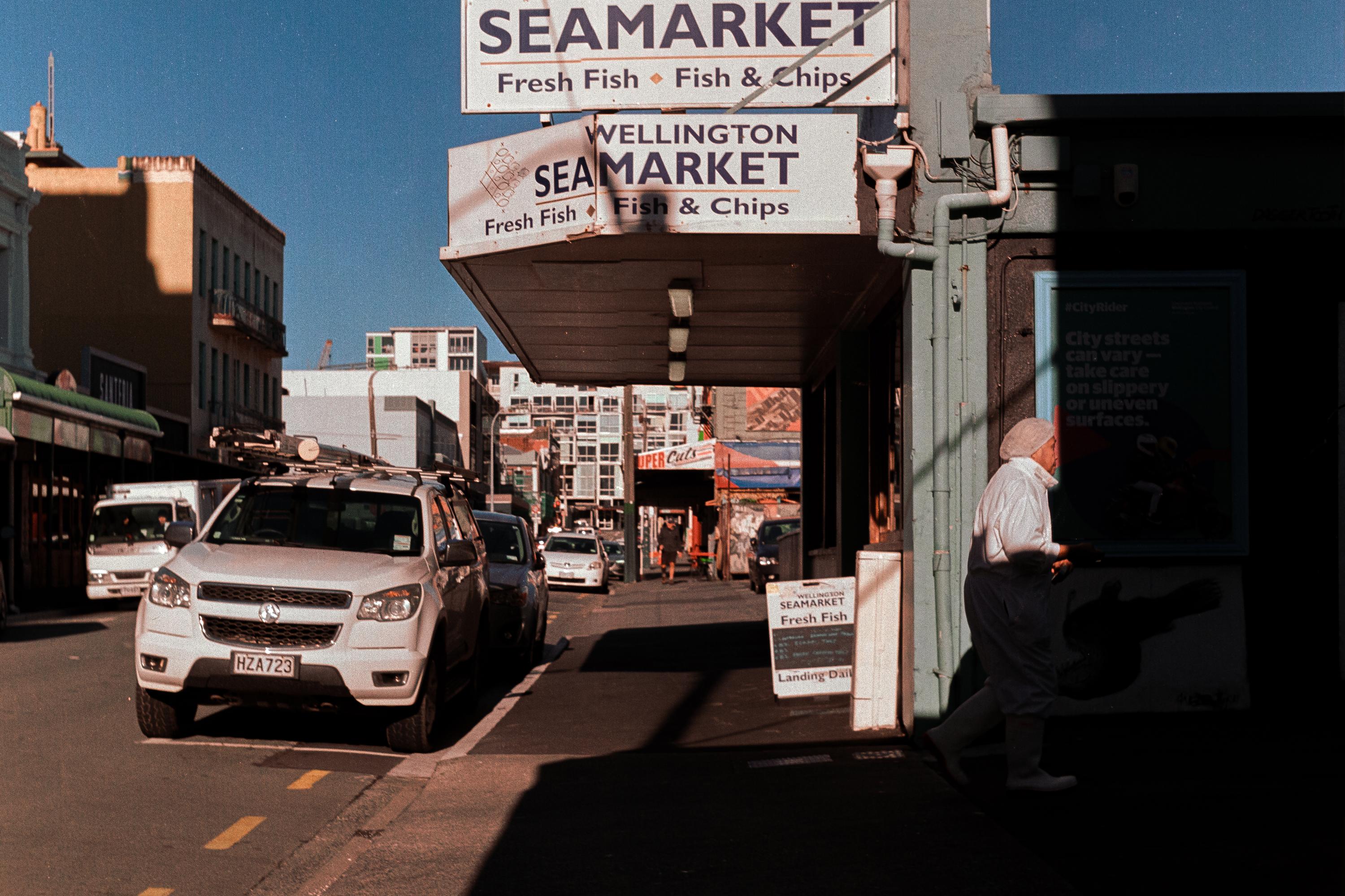 Photo of a fisherman unloading seafood at a fish market 