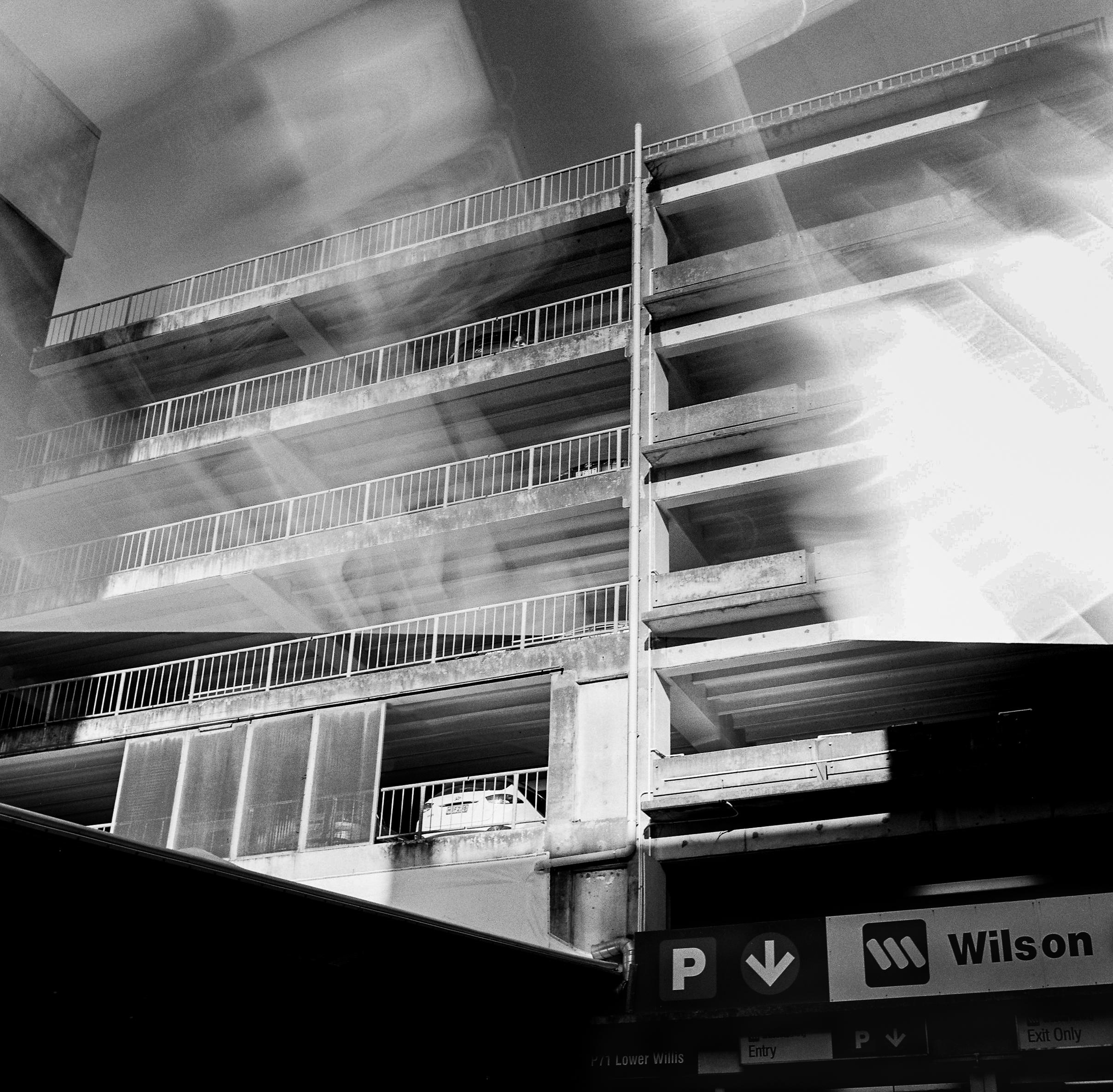 Photo of a parking garage with double exposure film effects