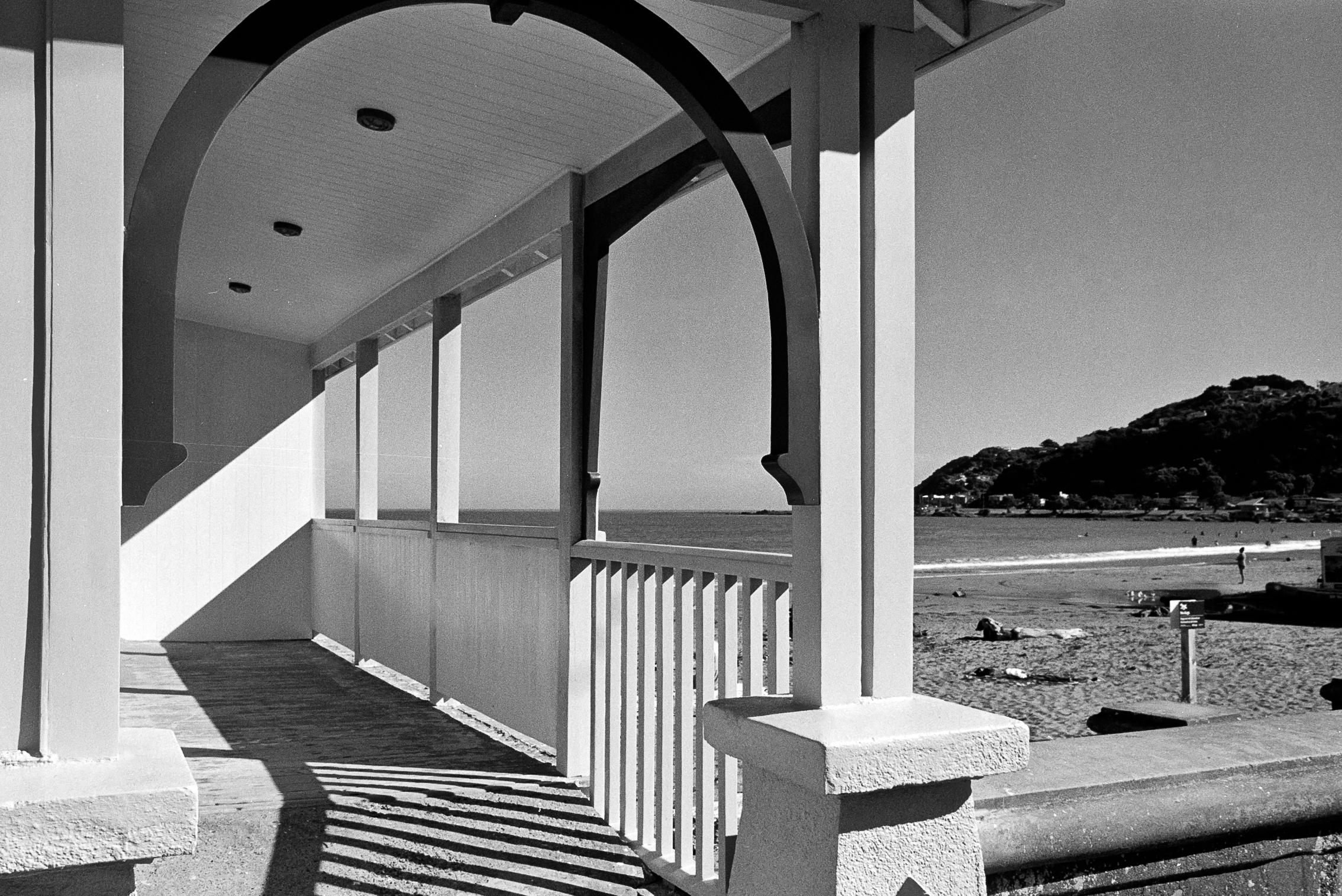 Photo of a building with arches on the beach