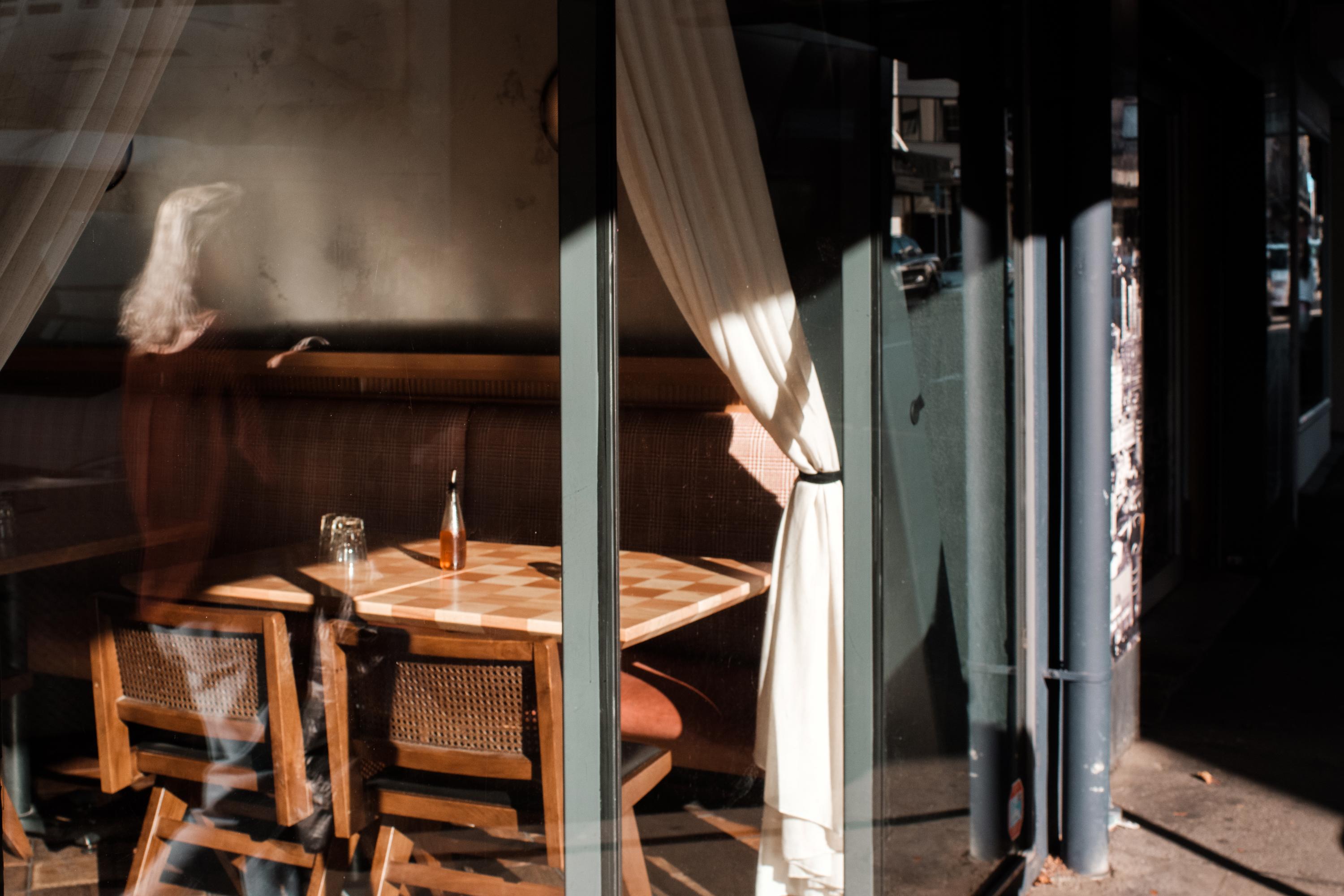 Photo of a diner table through a window 