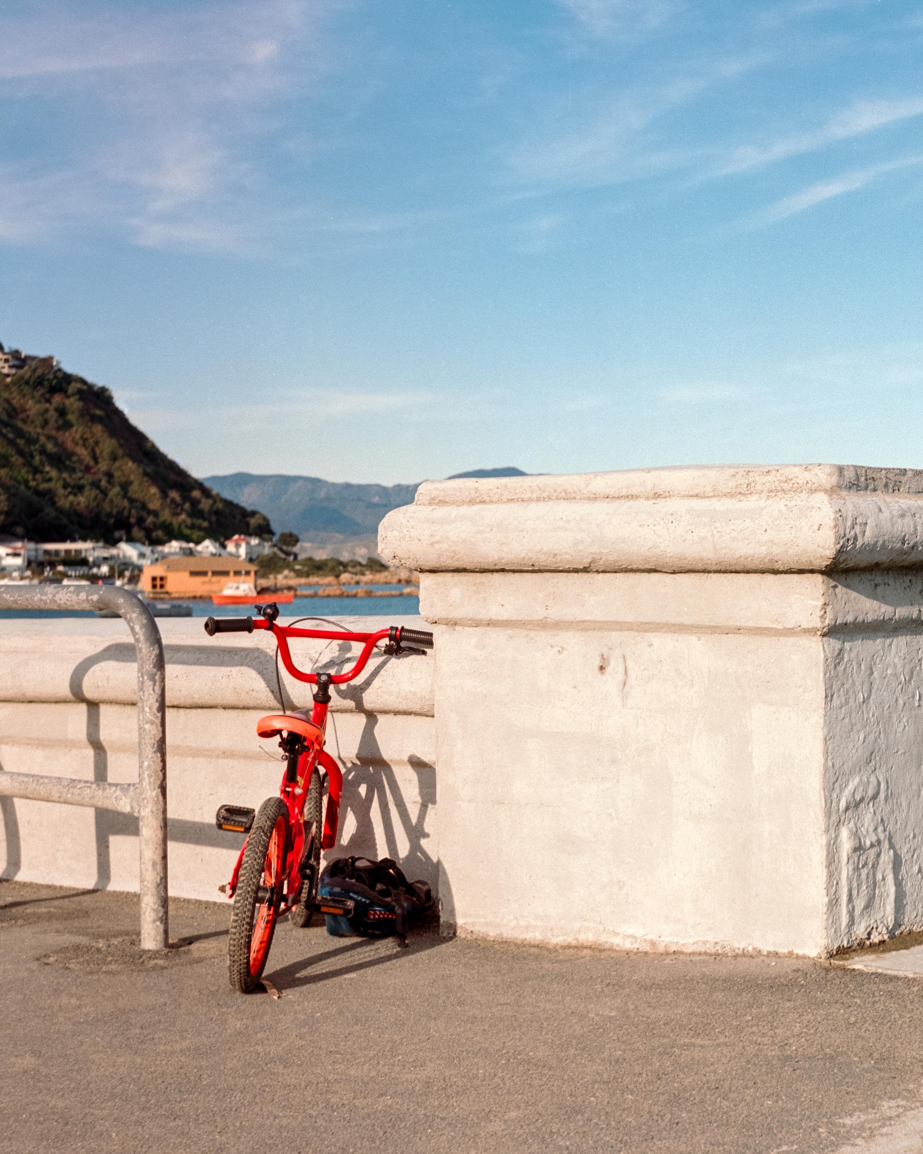 Photo of a child’s red bicycle 
