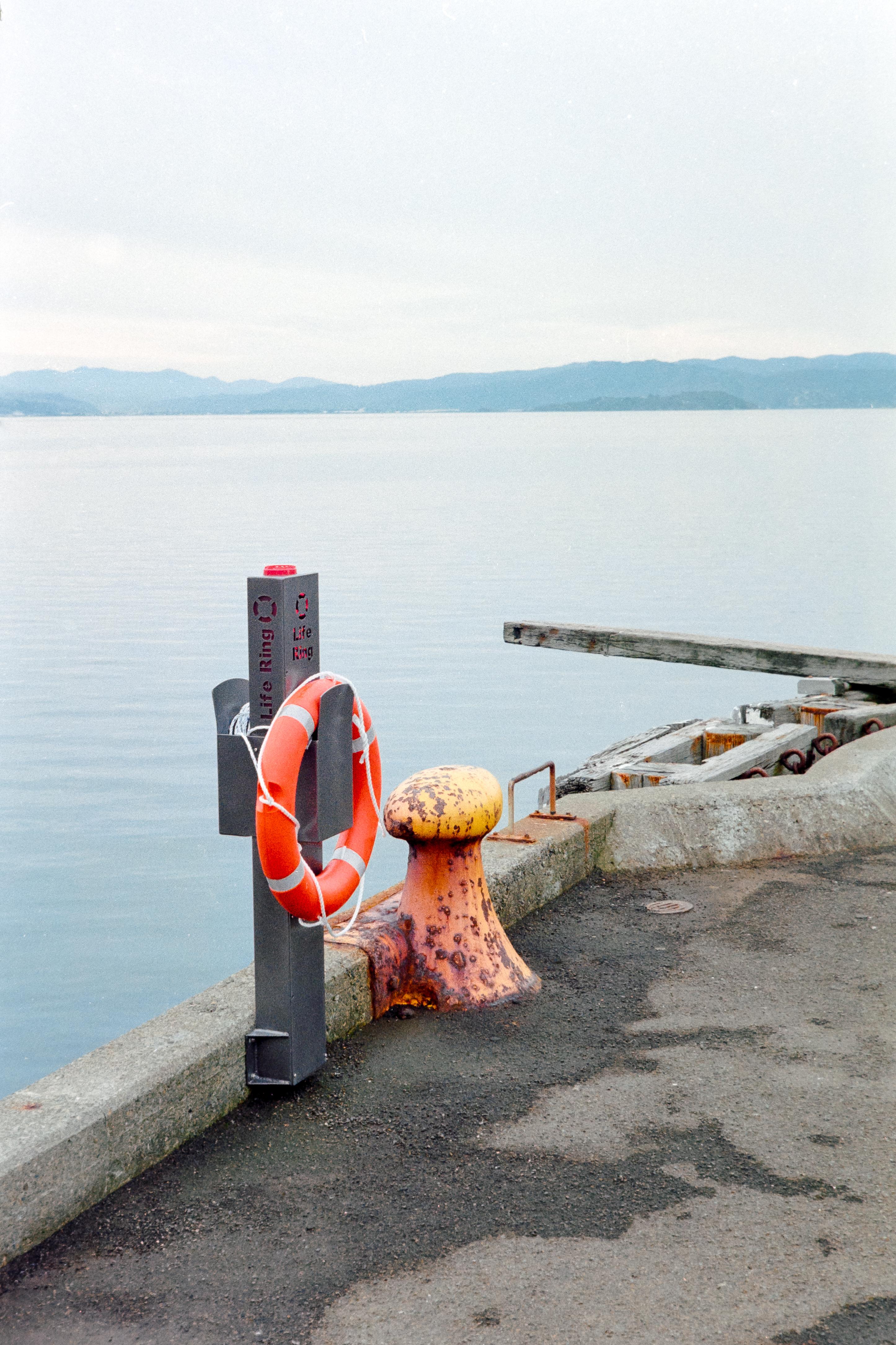 Photo of a ship bollard with life buoy on it 