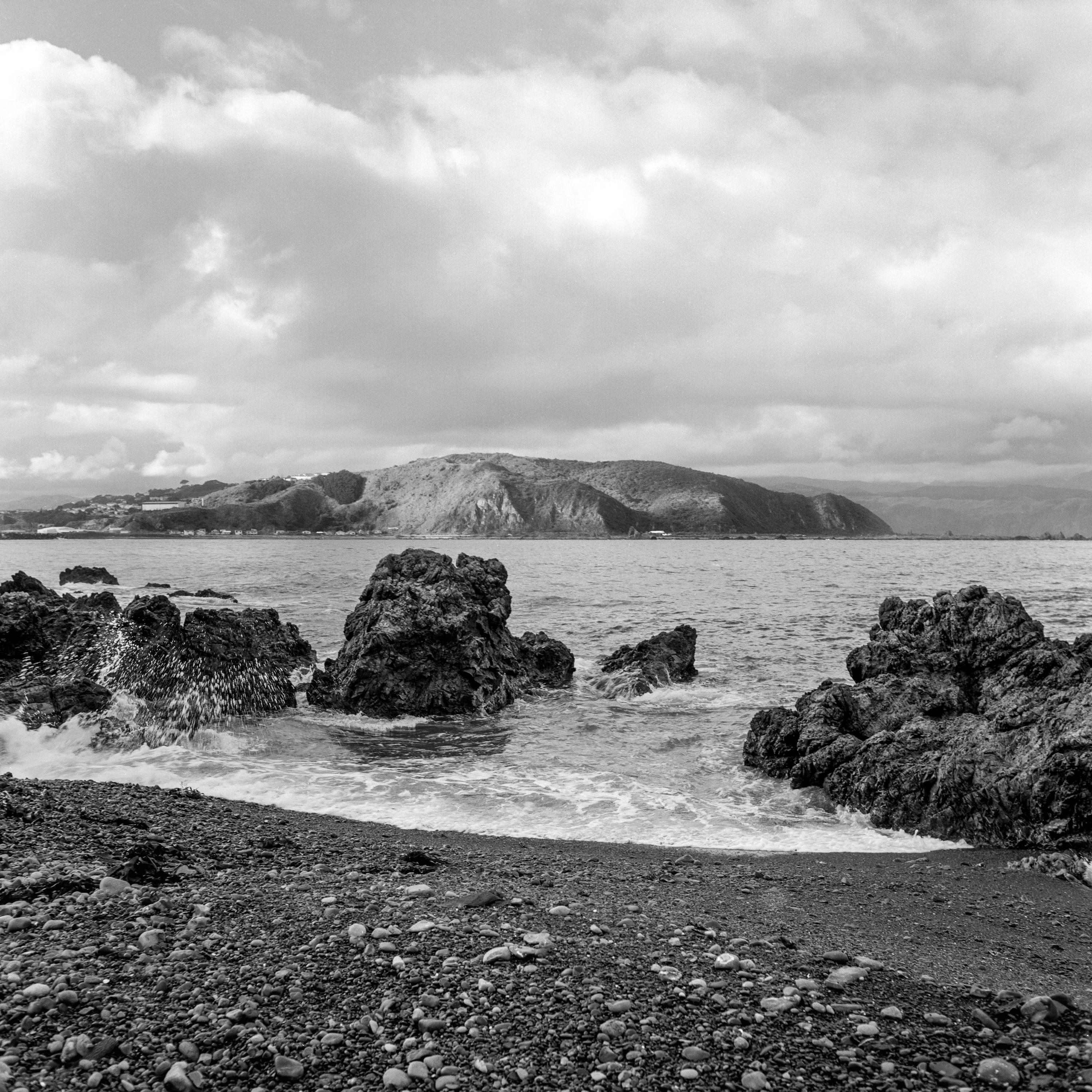 Photo of the shoreline amongst rocks 